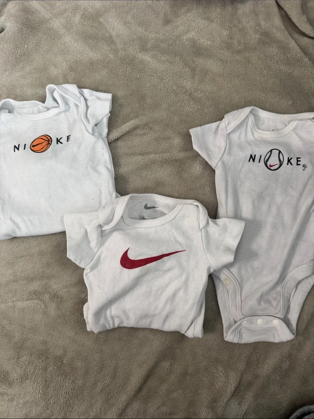 Nike White Baby Bodysuit Trio with Red and Orange Accents